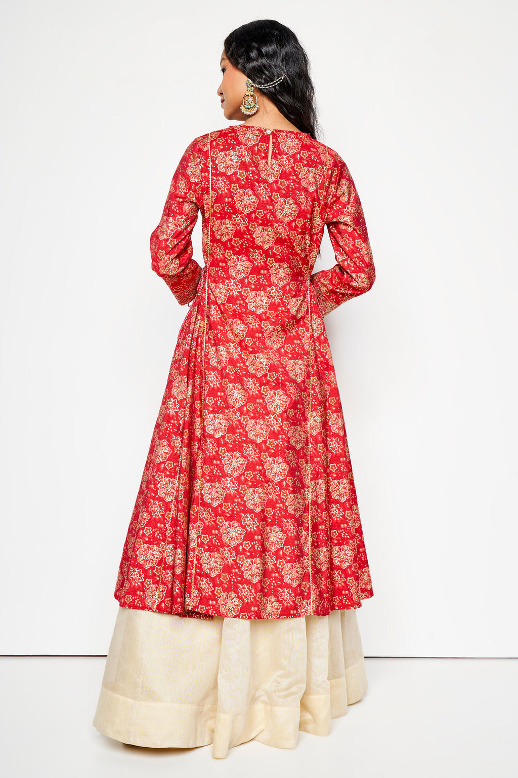 Red floral patterned kurta with white pants on a white background