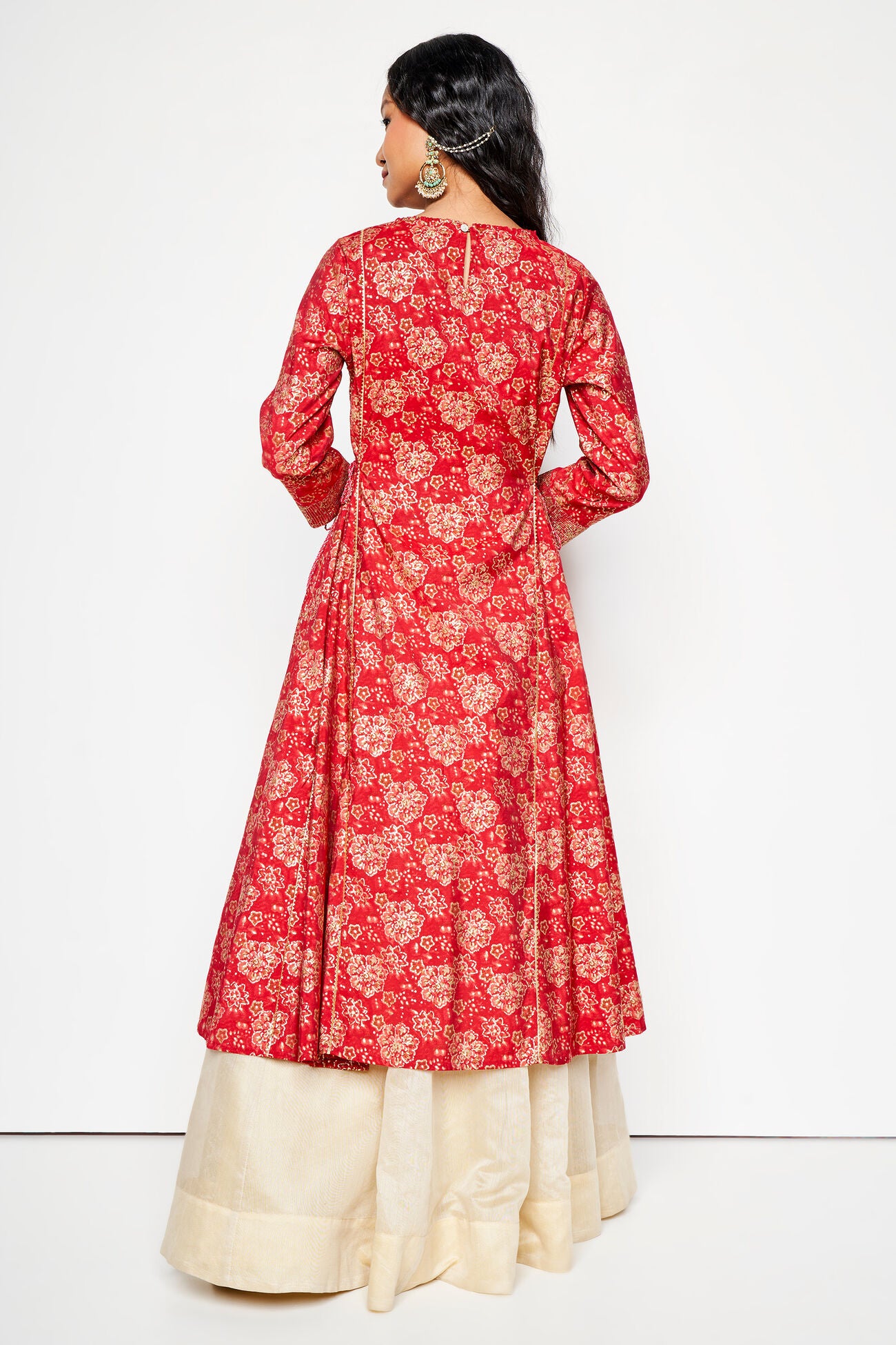 Red floral patterned kurta with white pants on a white background