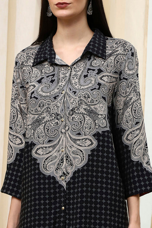 Black and white patterned shirt with intricate design on a neutral background
